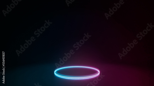 Neon colored glowing circle frame lying in darkness