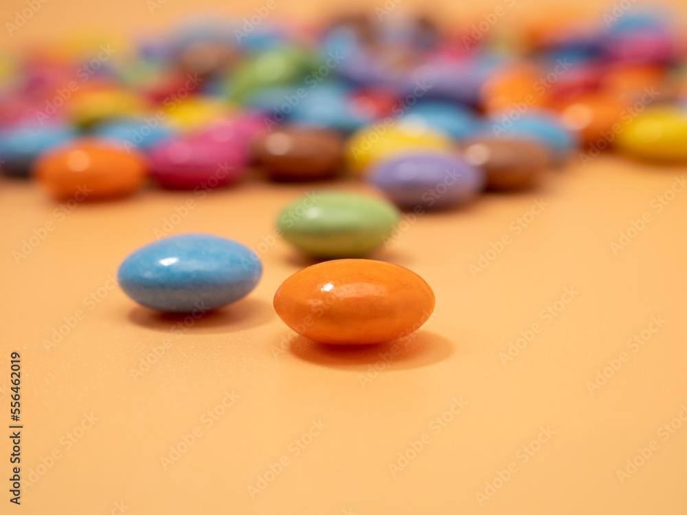 Small multi-colored round candies. Sweets covered with sugar icing. Small multi-colored round candies. Sweets covered with sugar icing.