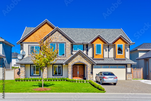 A perfect neigborhood. Luxury residential house with wide garage door