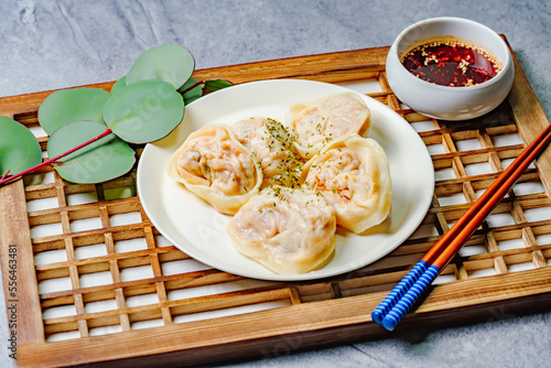 kimchimandu, Korean Kimchi dumpling : Kimchi dumplings are stuffed with a filling of chopped kimchi, bean curd, and vegetables. They are the most popular type of dumpling among Koreans. photo