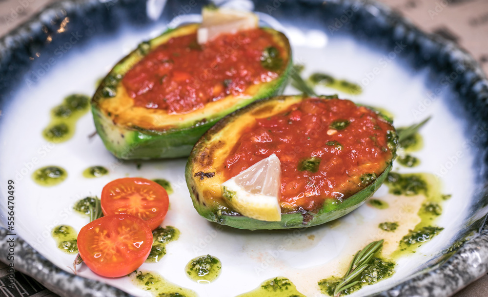 Restaurant dish fried avocado with tomato sauce Restaurant dish fried avocado with tomato sauce