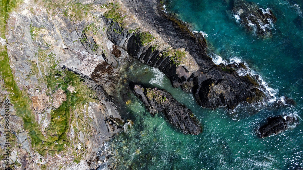 Epic cliffs of Ireland. The picturesque coast of the Celtic Sea, West Cork. Seascape, top view. Drone photo. Epic cliffs of Ireland. The picturesque coast of the Celtic Sea, West Cork. Seascape, top view. Drone photo.