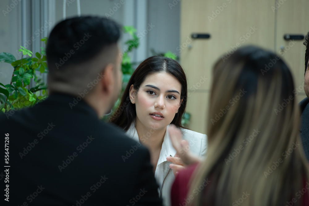 A group of young entrepreneurs. Meeting to exchange opinions and review information to prepare for investing in new stocks related to digital financial business. A group of young entrepreneurs. Meeting to exchange opinions and review information to prepare for investing in new stocks related to digital financial business.
