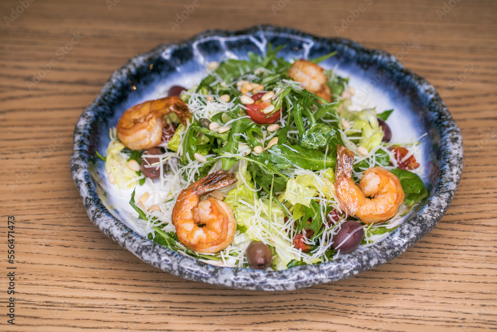 Restaurant dish salad with shrimp and olives Restaurant dish salad with shrimp and olives