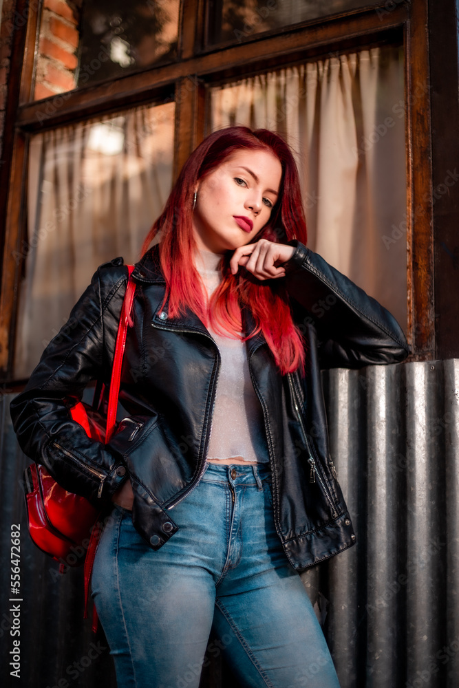 Obraz premium Young beautiful red hair woman wearing casual clothing on the street. Female fashion model red hair.
