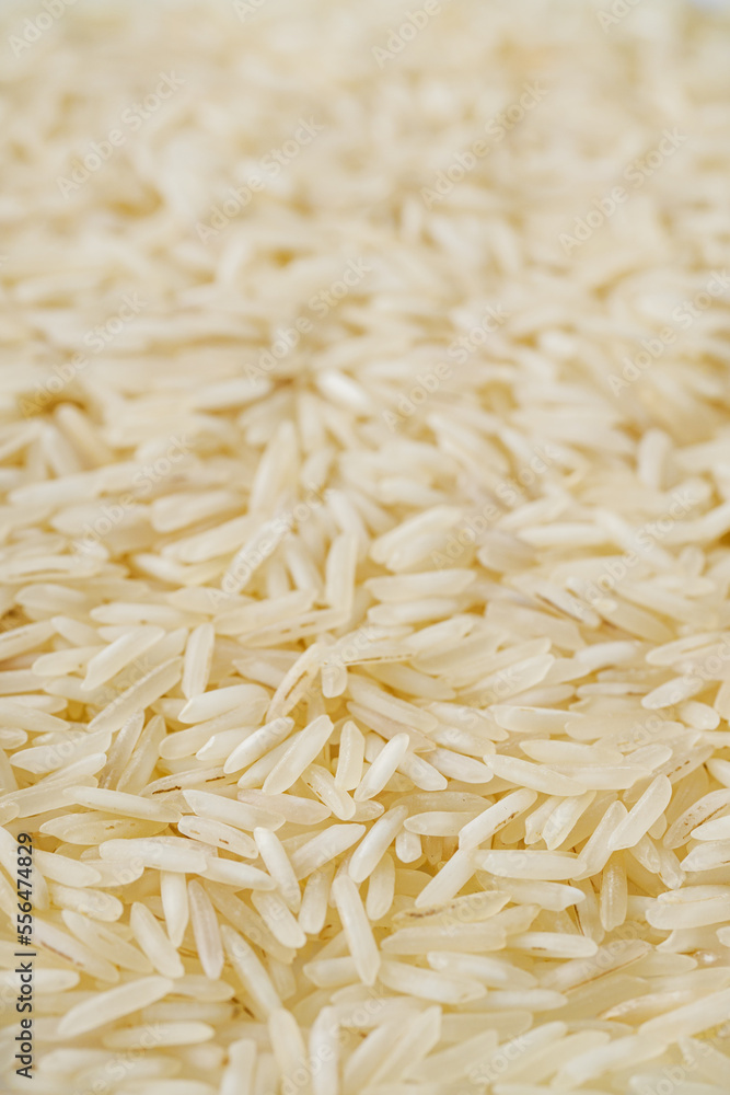 raw basmati rice on a white acrylic background raw basmati rice on a white acrylic background