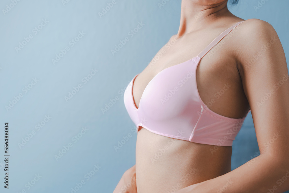 Woman bra concept, close up asian woman nude bra nice body isolated on background. Pink color