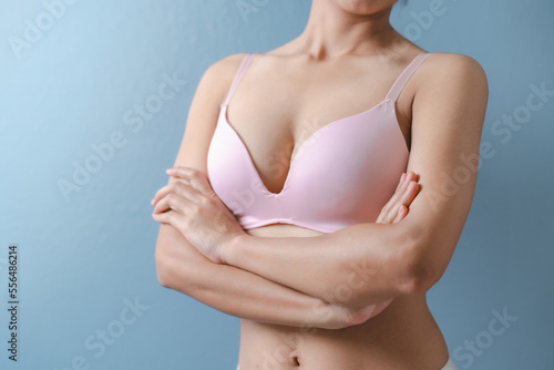 Woman bra concept, close up asian woman nude bra nice body isolated on background. Pink color