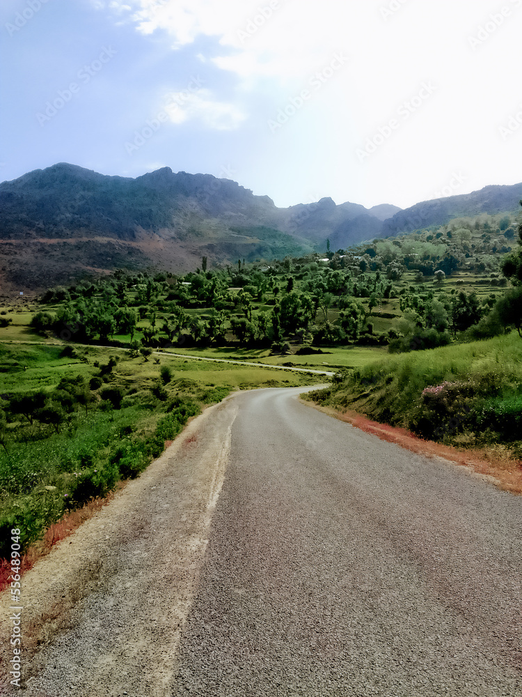 Gravel road through the countryside and mountains