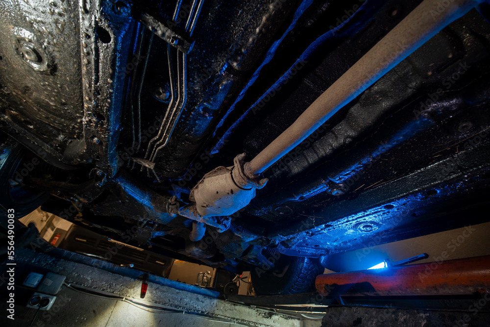 Vehicle underbody exhaust pipe, catalyst, resonator, exhaust system