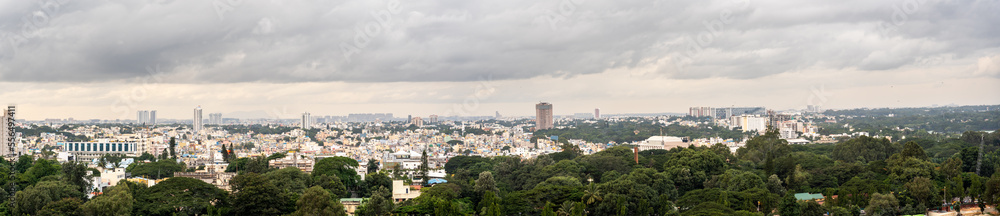 Aerial View of the center og Bengaluru with Storm Clouds on Skies and Trees in the foreground