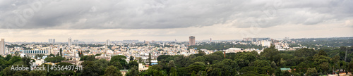 Aerial View of the center og Bengaluru with Storm Clouds on Skies and Trees in the foreground