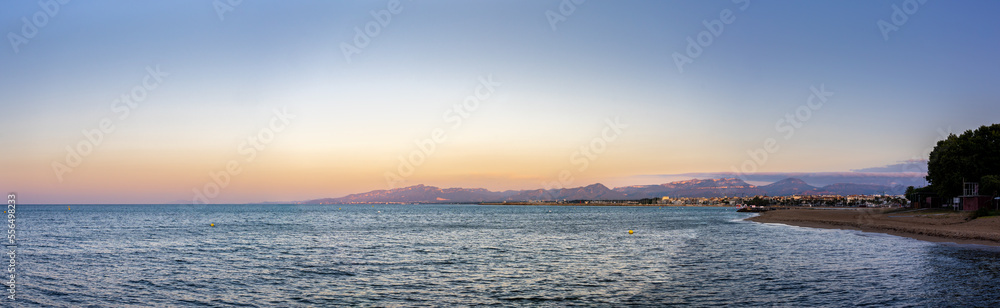 Large Panoramic View of Mediterranean Coastal City at Sunrise