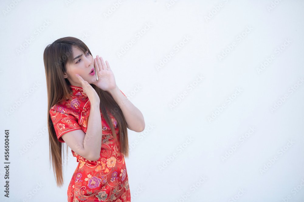 Portrait beautiful asian woman in Cheongsam dress on white background,Thailand people,Happy Chinese new year concept,Happy asian lady in chinese traditional dress Portrait beautiful asian woman in Cheongsam dress on white background,Thailand people,Happy Chinese new year concept,Happy asian lady in chinese traditional dress