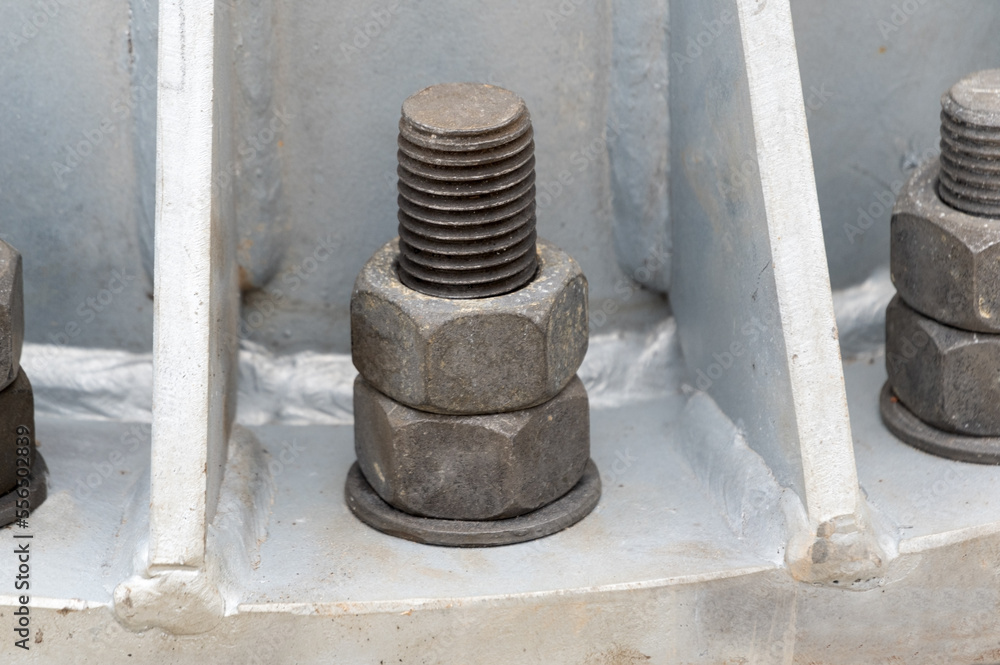 Big steel pole base locked with big bold nuts Big steel pole base locked with big bold nuts