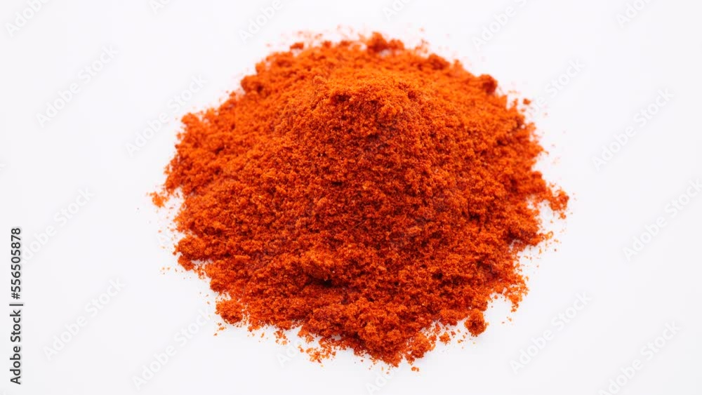 Chili pepper. Heap ground chili pepper on white background, rotation Chili pepper. Heap ground chili pepper on white background, rotation