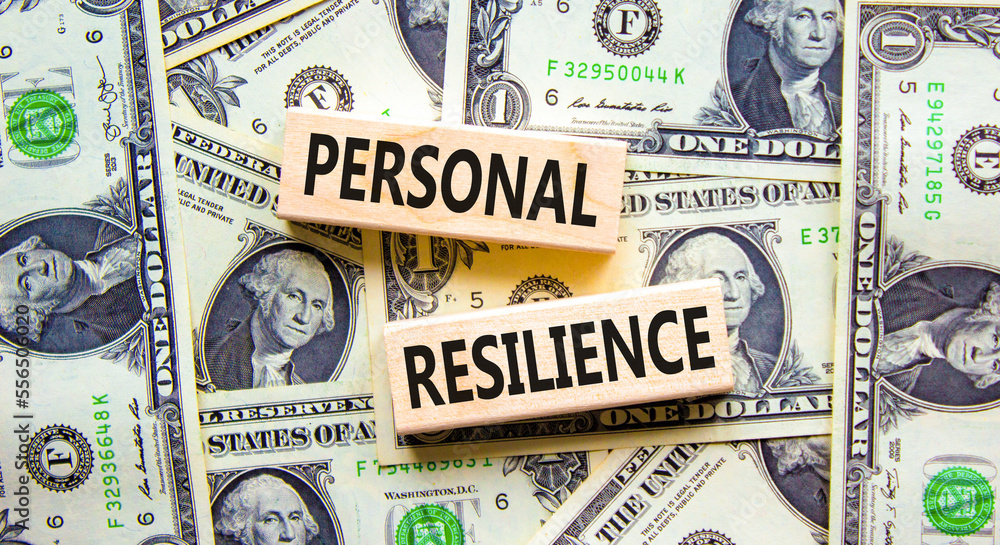 Personal resilience symbol. Concept word Personal resilience typed on wooden blocks. Beautiful background from dollar bills. Business psychological and personal resilience concept. Copy space.