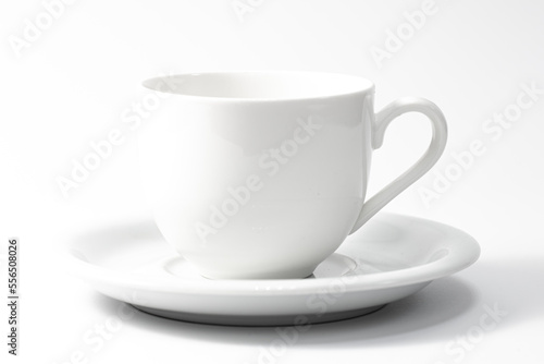 White cup and saucer isolated on white background.