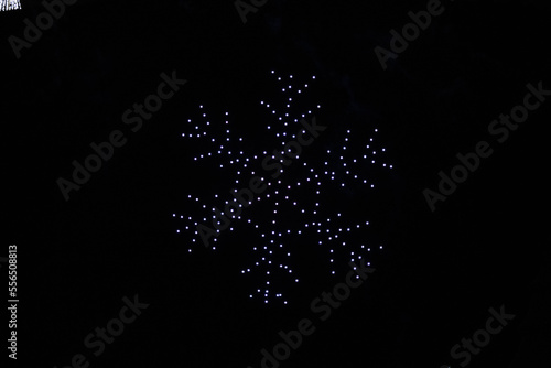 Slika na platnu A drone lightshow arranged in the shape of a snowflake