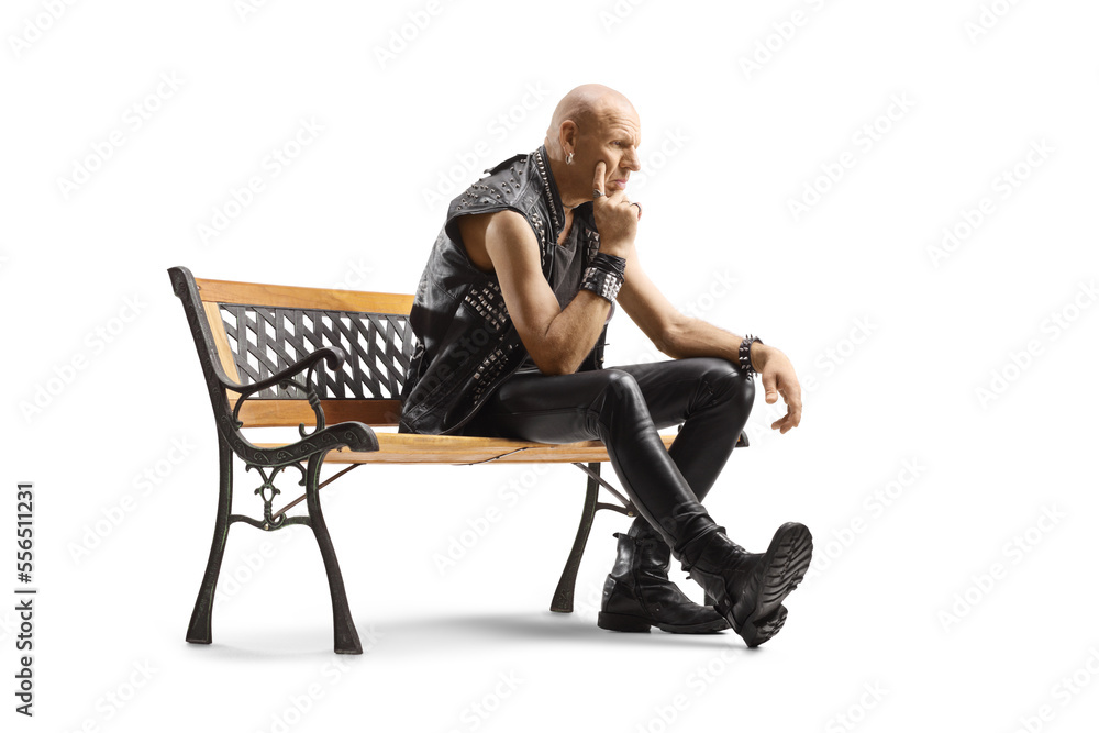 Pensive punk sitting on a bench Pensive punk sitting on a bench