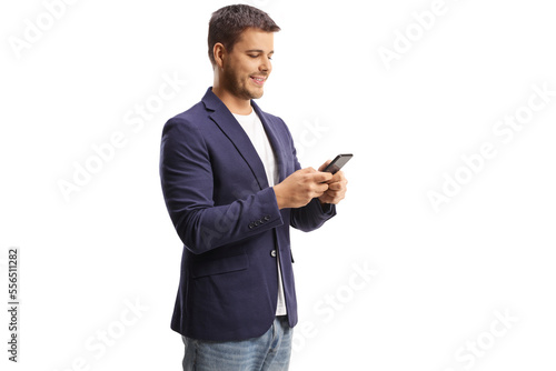 Side shot of a young man using a cellphone