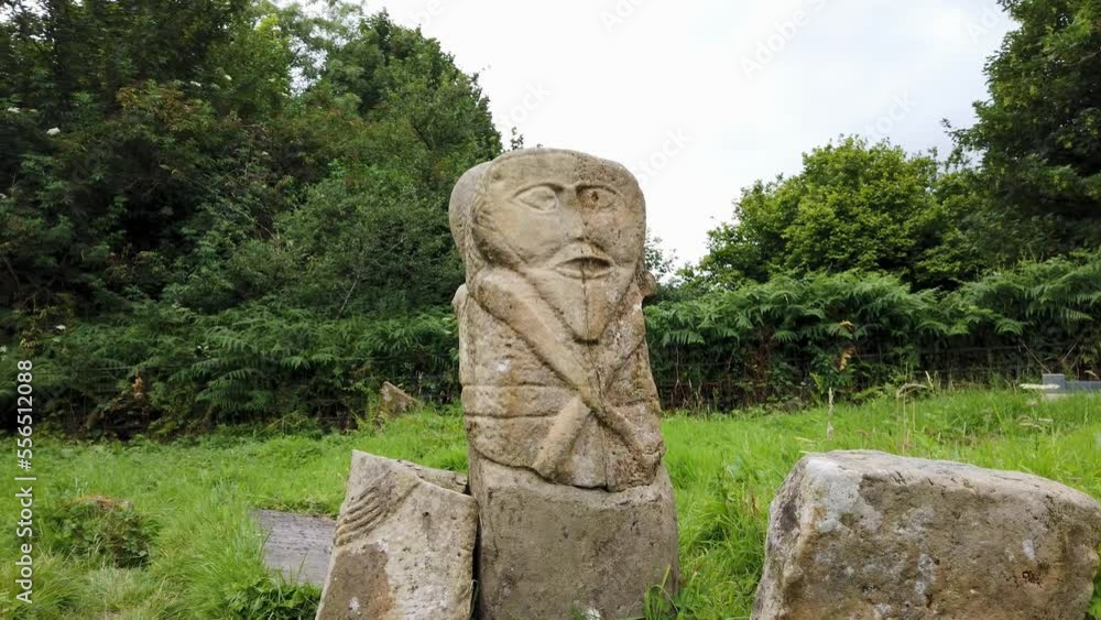 This is a bronze age stone carviing with two faces,called Janus, located In Caldragh Cemetery on Boa Island, Lower Lough Erne. Northern Ireland This is a bronze age stone carviing with two faces,called Janus, located In Caldragh Cemetery on Boa Island, Lower Lough Erne. Northern Ireland