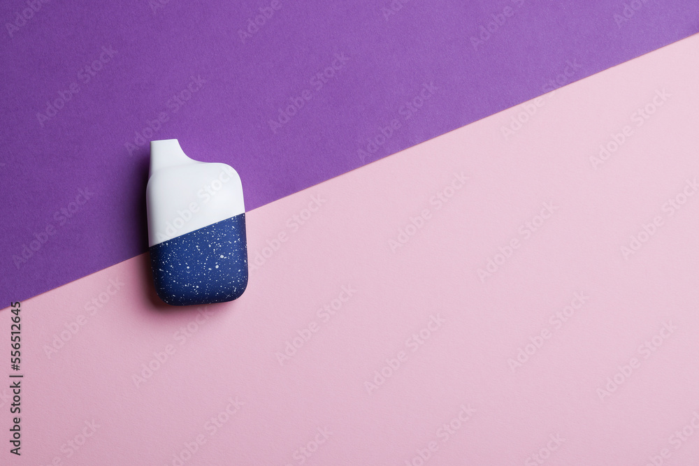 disposable electronic cigarette or vape on purple background. top view copy space. nicotine vapor stick. bad addiction and artificial nicotine disposable electronic cigarette or vape on purple background. top view copy space. nicotine vapor stick. bad addiction and artificial nicotine
