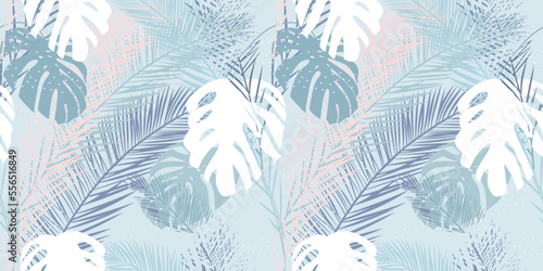 Vector seamless background with tropical leaves on a light background