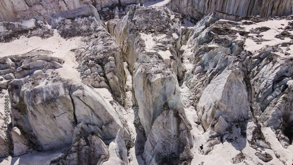 Beautiful cinematic aerial view of the icefall on the Mizhirgi Glacier Beautiful cinematic aerial view of the icefall on the Mizhirgi Glacier