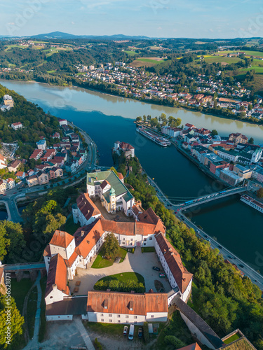 Aerial view of Fortress Veste Oberhaus and Veste Unterhaus with the old town of Passau in the background, Passau Germany © TambolyPhotodesign