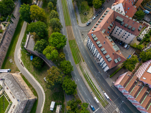 Aerial top view of the Neutorgraben street with railway tram tracks and houses surrounding, Nuremberg, Germany