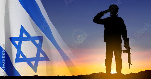 Silhouette of soldier with Israel flag against the sunrise. Concept - armed forces of Israel. EPS10 vector