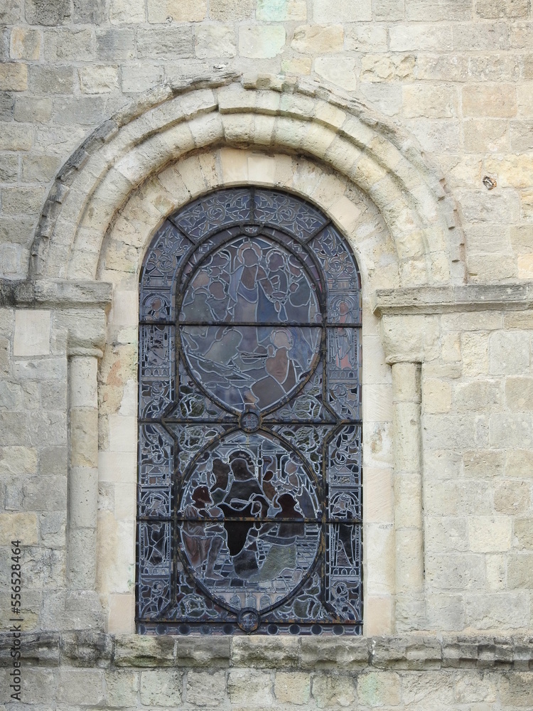 Arched stained glass window on the façade