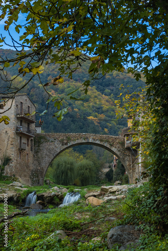 Beautiful view of the medieval bridge from below in the middle of nature.