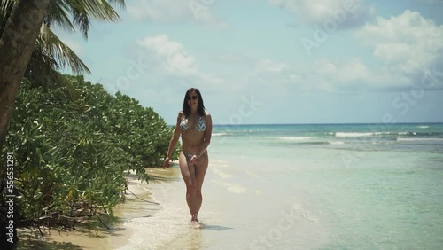 Young beautiful European female fit tanned model having fun at exotic paradise Saona island in Dominican Republic	
 photo