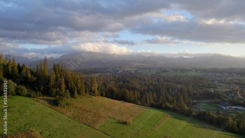 Top view of the mountains in shiny day, cloudy sky and forest in autumn. Drone aerial footage 4k Top view of the mountains in shiny day, cloudy sky and forest in autumn. Drone aerial footage 4k