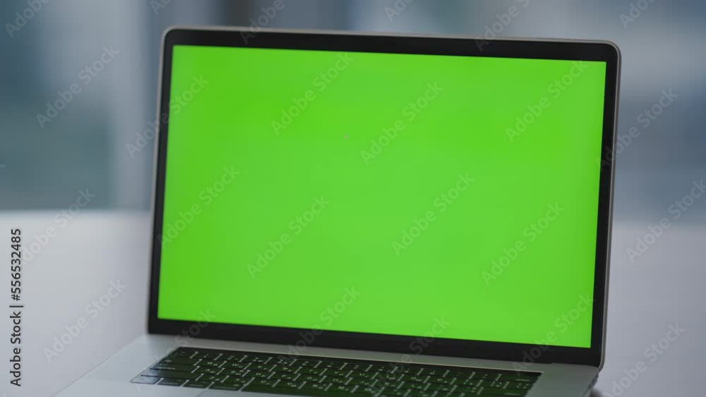 Green screen monitor laptop standing on office desk closeup. Chroma key computer Green screen monitor laptop standing on office desk closeup. Chroma key computer
