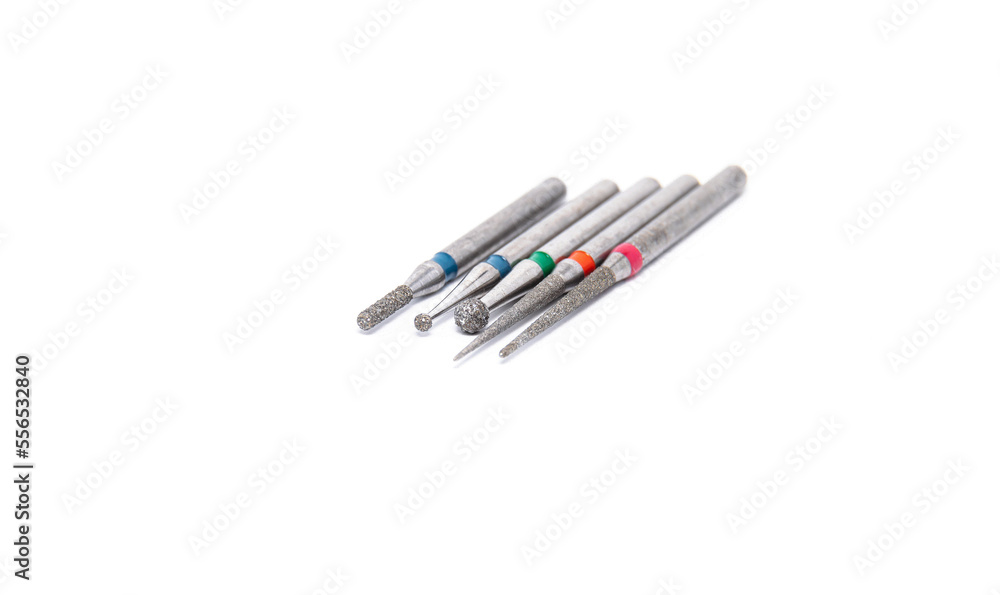 Diamond dental burs in close-up isolated against a white background. Dental tools for removing cavities and treating teeth. Teeth drilling.