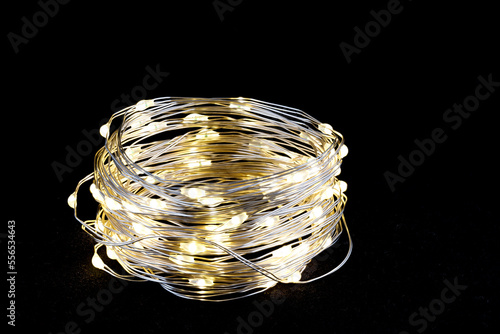 Wallpaper Mural Christmas garland on black background. Yellow colored light chain for decoration. Close-up Torontodigital.ca