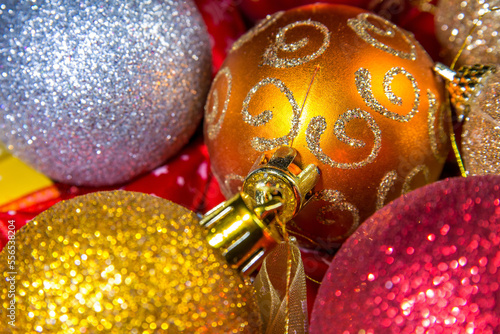 Christmas balls and beads on a shiny garland. Christmas mood and decoration with shiny light. Loop animation.