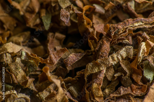 Crushed tobacco leaf close-up. macro photography. slow motion closeup