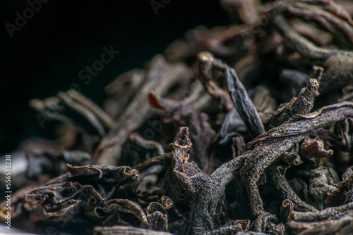 Dried black tea leaves close up. macro photography. Slow motion close-up