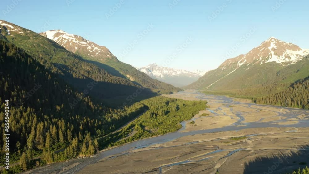 Aerial landscape, mountains range and a glacier-fed river, adventure inspiration. Summer, sunset Aerial landscape, mountains range and a glacier-fed river, adventure inspiration. Summer, sunset