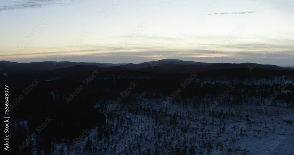 sunset in the arctic fjells in the background and a radiotower in lapland finland snow mountains wilderness sunset in the arctic fjells in the background and a radiotower in lapland finland snow mountains wilderness