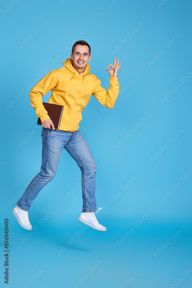 Fototapeta premium young happy man in casual clothes jumping