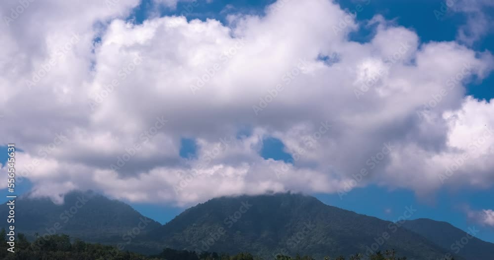 White clouds in blue sky above hills. Timelapse, fast moving. Climate, weather, fresh air concept White clouds in blue sky above hills. Timelapse, fast moving. Climate, weather, fresh air concept