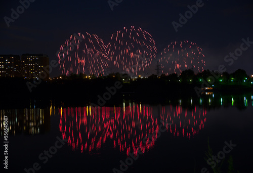 Beautiful fireworks with reflection in the pond