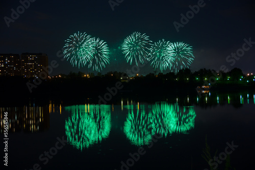 Beautiful fireworks with reflection in the pond photo