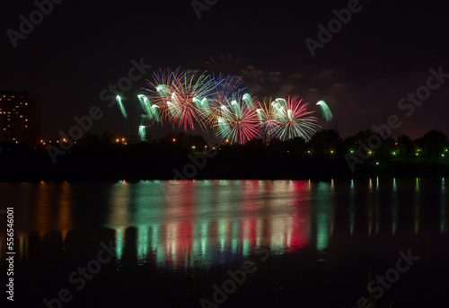 Beautiful fireworks with reflection in the pond