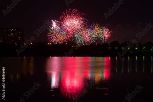 Beautiful fireworks with reflection in the pond